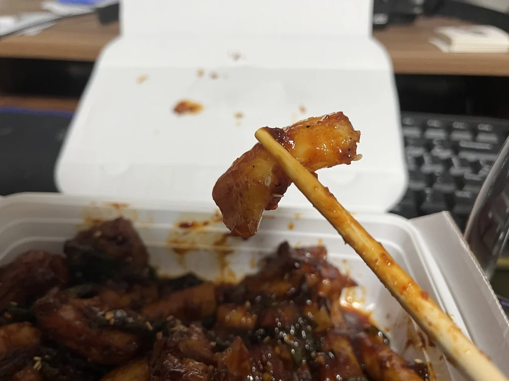 Spicy Korean yangnyeom chicken with rice cakes in Jicoba's signature sauce