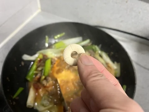 Cubed dubu tofu boiling in the Korean doenjang stew